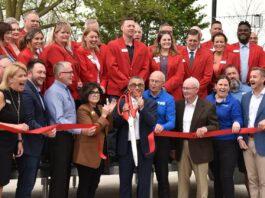 Marion Mayor Nick AbouAssaly (center) cuts the ribbon signifying the completion of Marion's Central Plaza project on Wednesday, May 7.