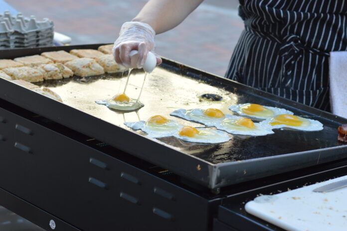 dtfm feedwell eggs Eggs fry on the grill of Feedwell Kitchen & Bakery during a previous Downtown Farmers Market in Cedar Rapids. Farm-fresh eggs are expected to be in high demand at markets this year. CREDIT CINDY HADISH