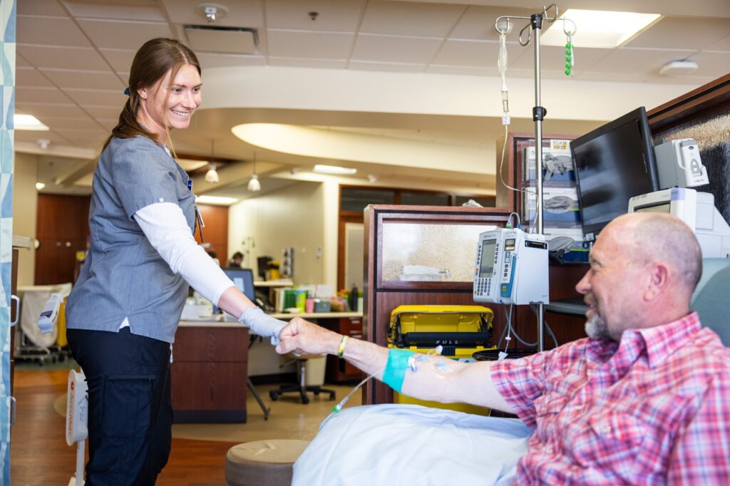 A UI Health Care nurse with a patient.