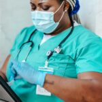 A nurse looks over her notes.