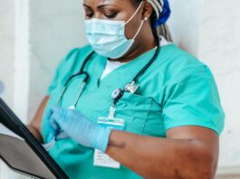 A nurse looks over her notes.