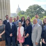 Economic and civic leaders from the Iowa Corridor pose with Representative Mariannette Miller-Meeks during the D.C. Fly-In.