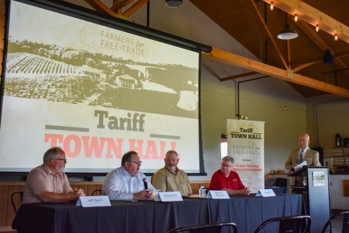 DSC_0733 Farmers for Free Trade held a Tariff Town Hall at Cedar Ridge Distillery Tuesday, June 17. (From left) Panelists Jeff Quint, CEO of Cedar Ridge Distillery; Richard Dix, vice president of supply chain management with Kinze Manufacturing; Matthew Willimack, board director with Iowa Soybean Association; Chad Hart, economist with Iowa State University; and moderator John Lohman, CEO of the Corridor Business Journal.