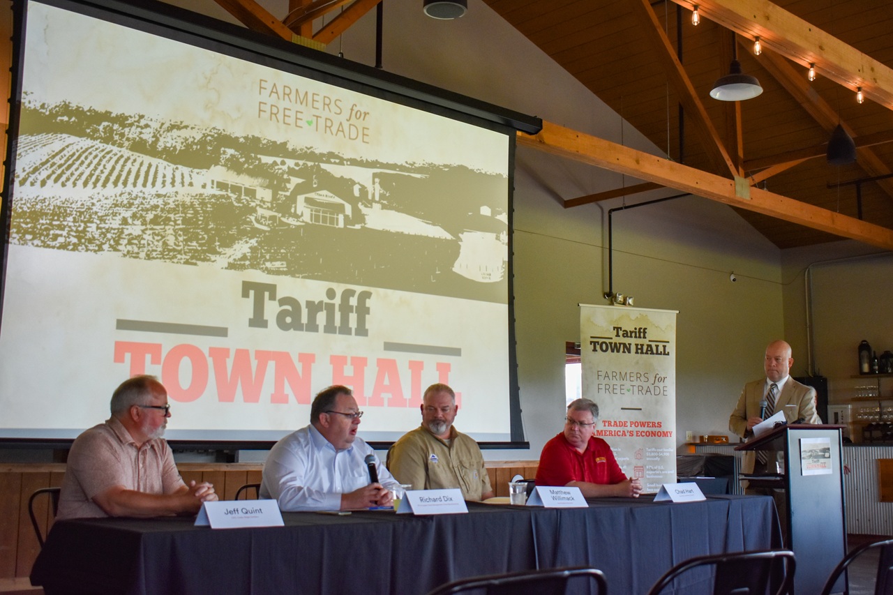 DSC_0733 Farmers for Free Trade held a Tariff Town Hall at Cedar Ridge Distillery Tuesday, June 17. (From left) Panelists Jeff Quint, CEO of Cedar Ridge Distillery; Richard Dix, vice president of supply chain management with Kinze Manufacturing; Matthew Willimack, board director with Iowa Soybean Association; Chad Hart, economist with Iowa State University; and moderator John Lohman, CEO of the Corridor Business Journal.