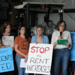 Jennifer Sherer (right), director of the State Worker Power Initiative with the Economic Policy Institute, speaks during the Johnson County manufactured home park press conference June 18.