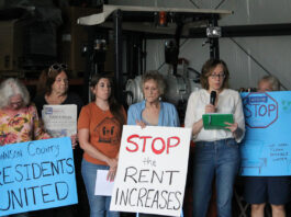 Jennifer Sherer (right), director of the State Worker Power Initiative with the Economic Policy Institute, speaks during the Johnson County manufactured home park press conference June 18.