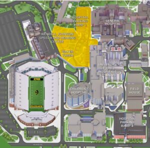 The highlighted area indicates where the patient care tower will go. The Wendell Johnson Speech and Hearing Center, Parking Ramp 1 and the water tower currently there will be demolished.