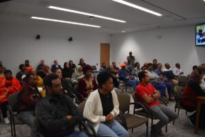 Audience members packed the Johnson County Board of Supervisors board room to hear a presentation on a proposed immigration welcome center June 4.