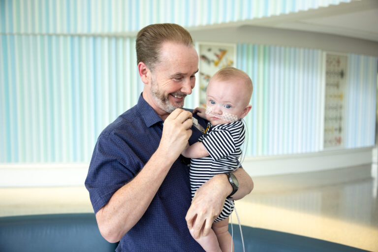 Neonatologist Patrick J. McNamara MB, BCh, visits with Nash Keen and Nash’s parents Mollie and Randall Keen at University of Iowa Health Care Stead Family Children’s Hospital on Wednesday, June 4, 2025. Nash was born in July 2024 as the earliest baby ever born at 21 weeks, 0 days gestation. He has survived with very minimal complications and is home and thriving.