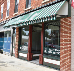Renovated building fronts, like Grant Wood Area Abstract on 206 W. Main St., received brick treatment, awnings, new windows and paint.