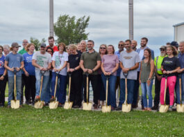 Frontier Co-op employees celebrate at the company's groundbreaking ceremony, marking the beginning of its expansion on its distribution facility in Belle Plaine