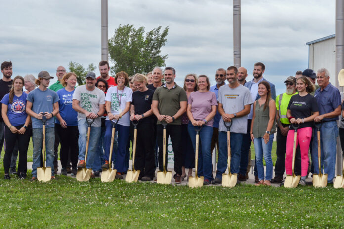 Frontier Co-op employees celebrate at the company's groundbreaking ceremony, marking the beginning of its expansion on its distribution facility in Belle Plaine