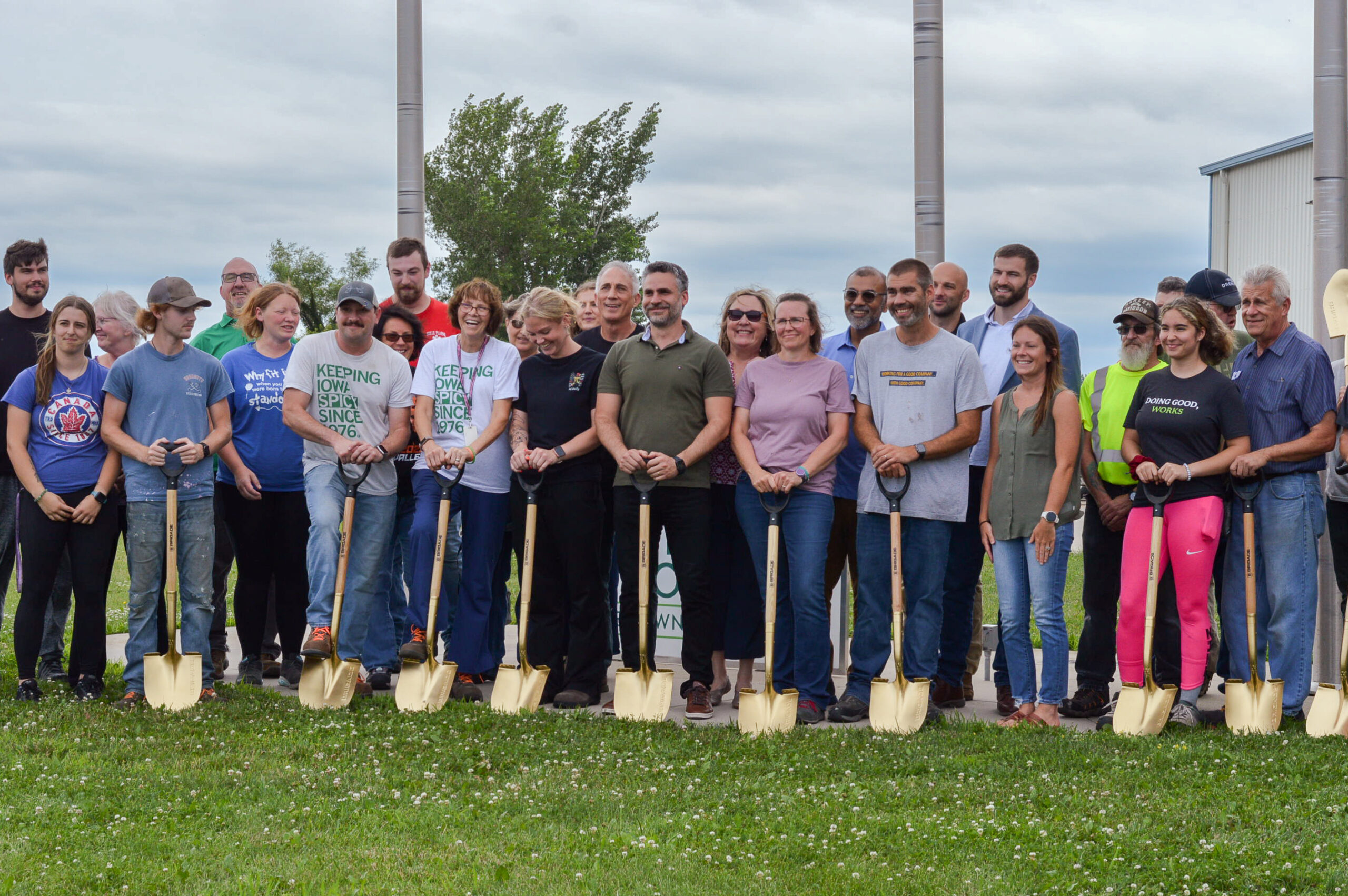 Frontier Co-op employees celebrate at the company's groundbreaking ceremony, marking the beginning of its expansion on its distribution facility in Belle Plaine