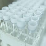Empty test tubes line a tray
