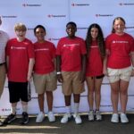 Winners of the "Saving for a Rainy Day" contest pose with Will Fuller, president and CEO of Transamerica (far left) and Laura Wirth, head of corporate development at Transamerica (far right).