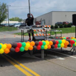 DJ Tone Da Boss of T1 Entertainment takes the stage during the July 12 Unity Exchange on Keokuk Street in the So. of 6 Iowa City Business District.