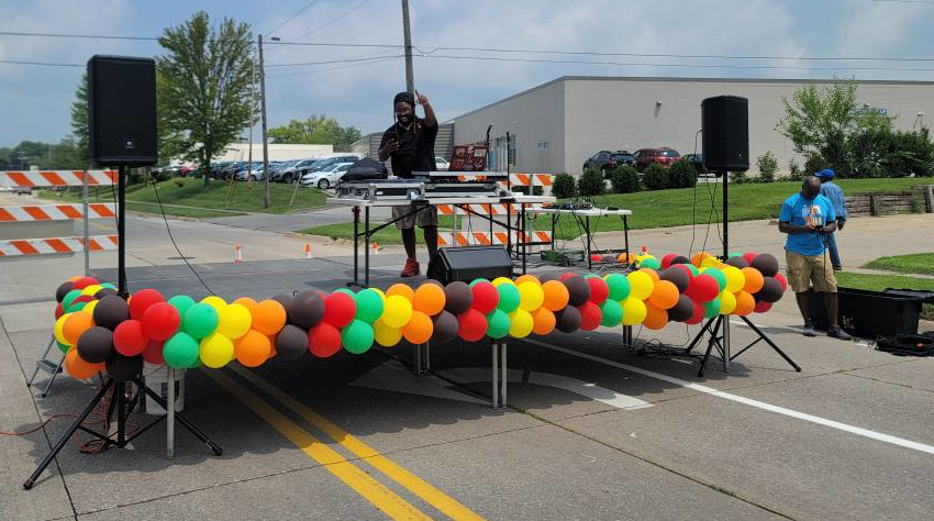 DJ Tone Da Boss of T1 Entertainment takes the stage during the July 12 Unity Exchange on Keokuk Street in the So. of 6 Iowa City Business District.
