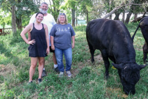 Madison Zeringue, Kyle Schuchmann and Sarah Bailey of Jiyu American Wagyu with Oh No, the company’s prized Wagyu bull. CREDIT RICHARD PRATT