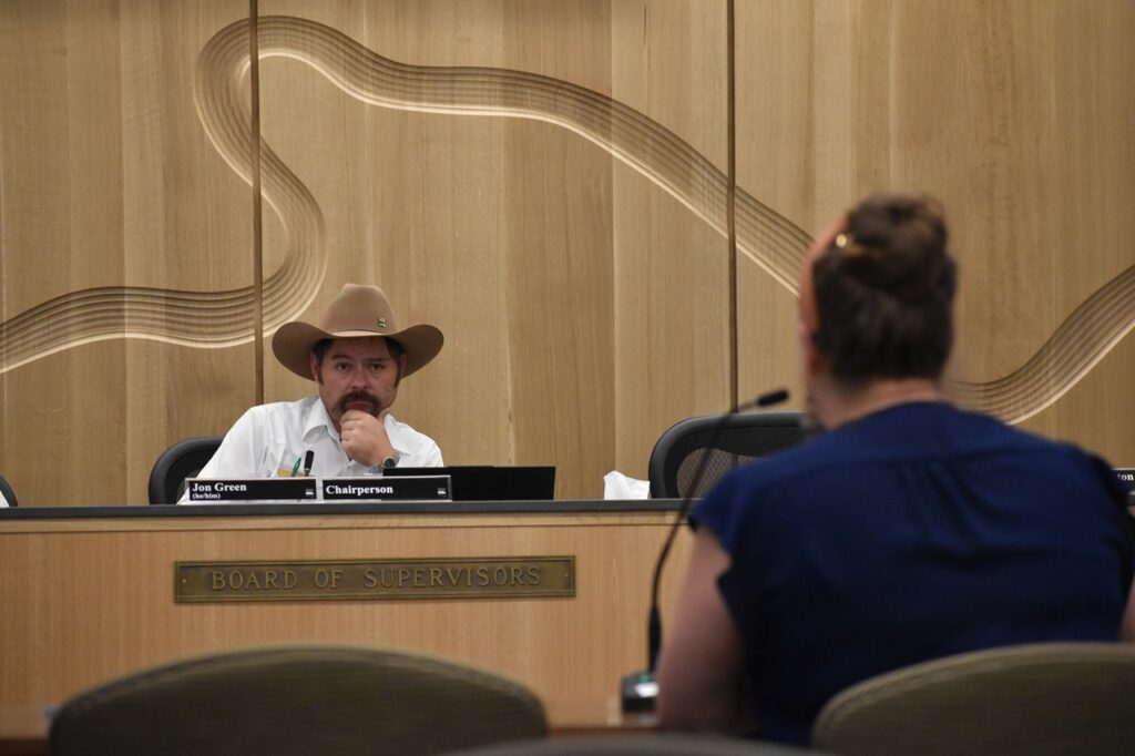 Johnson County Supervisor Board Chair Jon Green listens to Emily Meister, director of community impact and engagement with United Way of Johnson & Washington Counties at a work session Wednesday, Aug. 20.