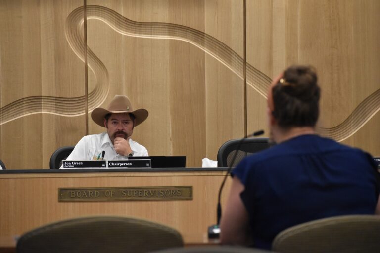 Johnson County Supervisor Board Chair Jon Green listens to Emily Meister, director of community impact and engagement with United Way of Johnson & Washington Counties at a work session Wednesday, Aug. 20.