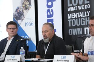 Loras Schaul (center), owner of Douglas Machine and Engineering LLC