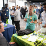 UI Health Care career fair participants connect with employers representing Iowa health systems July 31. The career event aimed to address physician shortage in Iowa.