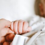 Photo by Lisa from Pexels: https://www.pexels.com/photo/person-holding-baby-s-hand-2721581/