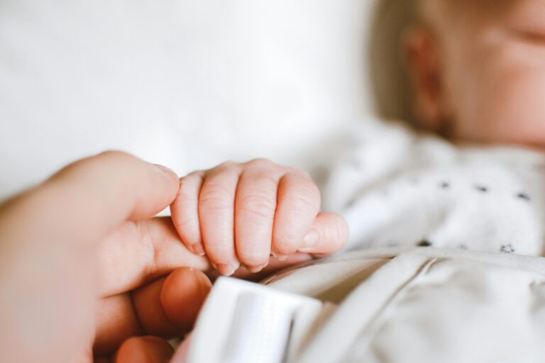 Photo by Lisa from Pexels: https://www.pexels.com/photo/person-holding-baby-s-hand-2721581/