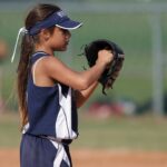 Girl playing softball youth sports