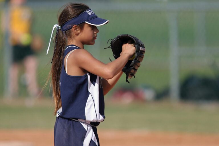 Girl playing softball youth sports