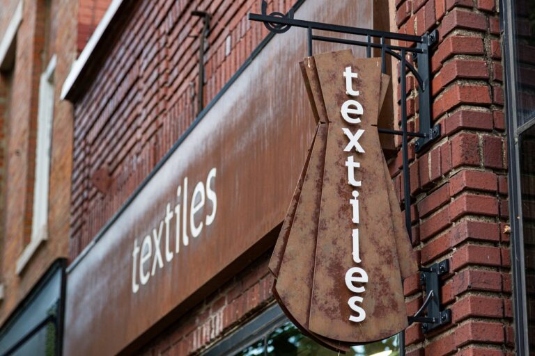 Textiles' store sign at 105 S. Dubuque St. in the Ped Mall.
