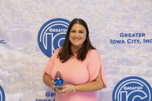 Shannon Penisten with the Spirit of Rural Prosperity award at Greater Iowa City, Inc.'s A Toast to Business award ceremony May 1, 2025.