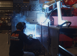 The ALM-developed Voice Initiated Kinetic Intelligence (VIKI) headset, is incorporated via Bluetooth into welder’s helmets. AI CREDIT ALM