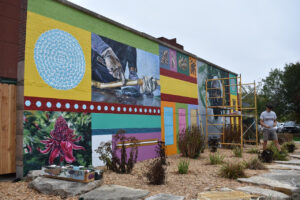 A mural at Coralville’s New Pioneer Co-op featuring A.G. Nandasena, who grows cinnamon for Frontier Co-op's spice line – which is sold at the store – is one of three murals commissioned by Fairtrade America.