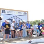 Students from the Tiffin school district are all grins as they don hardhats and hold shovels for the groundbreaking of the city's $10 million recreation center on Sept. 16, 2025.