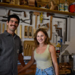 Drew Hart and Annie McElree of Fenokee furniture pose in their workshop in Cedar Rapids Sept. 26, 2025. CREDIT ANNIE SMITH BARKALOW