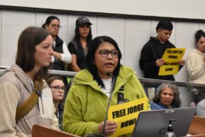 Eva Castro speaks during the public comment period at the Johnson County joint entities meeting Oct. 20. Jorge González, the fiancé of Ms. Castro's daughter, was detained by ICE officers at his workplace in September.