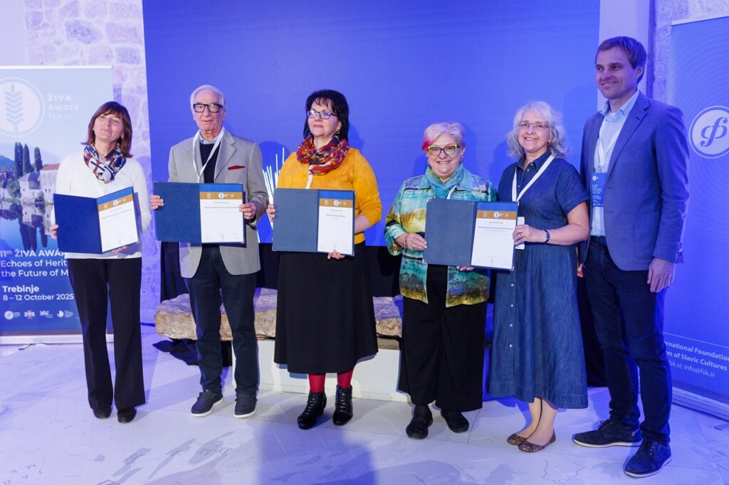 (Third from right) Cecilia Rokusek, NCSML president and CEO, and Stefanie Kohn, curator, display their award at the Živa Award ceremony.