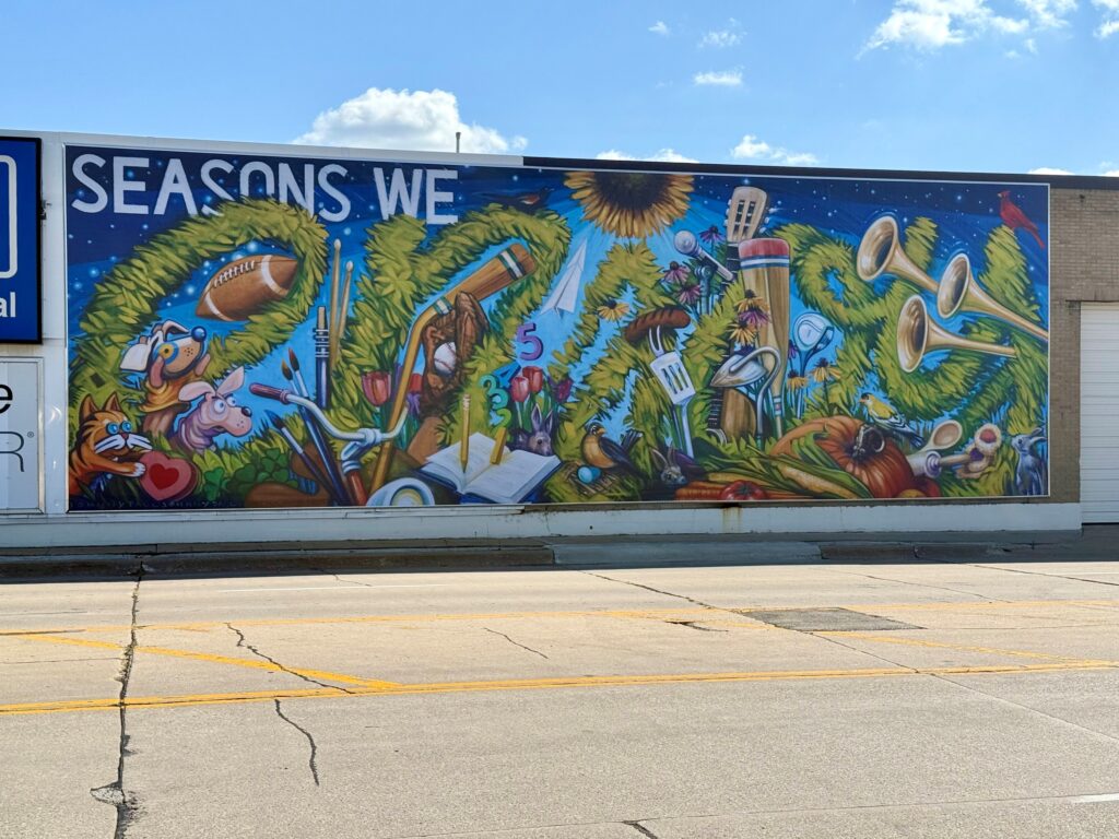 The MedQuarter District's new mural titled "Seasons We Enjoy" by Cedar Rapids artist John Paul Schafer.
