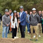 Stephanie and Taylor Getting (center), co-owners of Calyx Creek Lavender & Lodging at the groundbreaking of their new treehouse accommodations Oct. 30.
