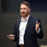 NeuroPred, Inc. co-founder Michal Brzus gives his pitch at the Iowa JPEC AI Pitch Competition Nov. 5.