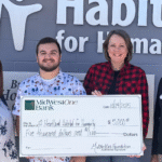 Waterloo's Iowa Heartland Habitat for Humanity poses with a $5,000 check from The MidWestOne Foundation.