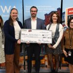 (From left) Carol Lilly, state coordinator with Main Street Iowa; Main Street Washington committee member Sally Hart; building owner of 115-117 N Iowa Ave. Luke Leyden; Samantha Meyer, Main Street Washington's executive director; and Debi Durham, director of IEDA and the Iowa Finance Authority.