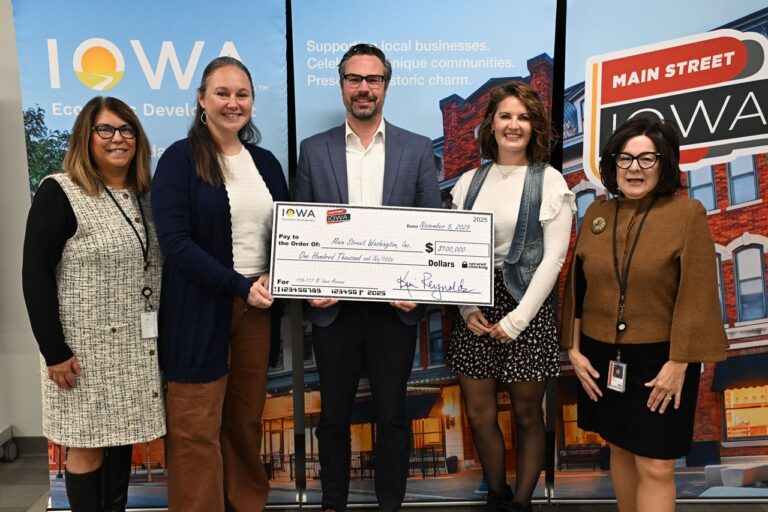 (From left) Carol Lilly, state coordinator with Main Street Iowa; Main Street Washington committee member Sally Hart; building owner of 115-117 N Iowa Ave. Luke Leyden; Samantha Meyer, Main Street Washington's executive director; and Debi Durham, director of IEDA and the Iowa Finance Authority.