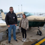 Luke Hewitt, instructor with Coe College's aviation management and flight operations program, stands next to Addy LuGrain, the first of three aviation students in the program's history to complete a solo flight.