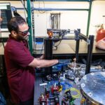 John Prineas, Ravitej Uppu, Thomas Folland work in the Quantum Light Control Lab. The three UI researchers are principal investigators on an award to expand Iowa's materials science center and to explore new ways to leverage materials for quantum technologies.