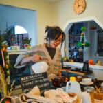 Anh Le, owner of Anh’s Bread Therapy and Tea House, prepares tea in December inside her shop in Czech Village. PHOTOS BY CINDY HADISH