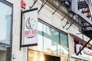 A sign advertising Luna's Tacos in downtown Iowa City