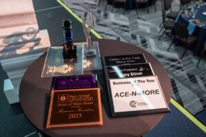 The 2025 Citizen of the Year and 2025 Business of the Year awards sit on a table at the Greater Washington Business Partnership Annual Dinner & Awards Night March 2.