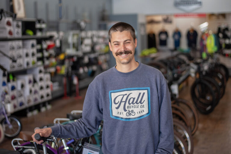 Hall Bicycle owner Kyle Moscrip stands for a portrait in the retail showroom of his bicycle shop in downtown Cedar Rapids. CREDIT KYLE MOSCRIP